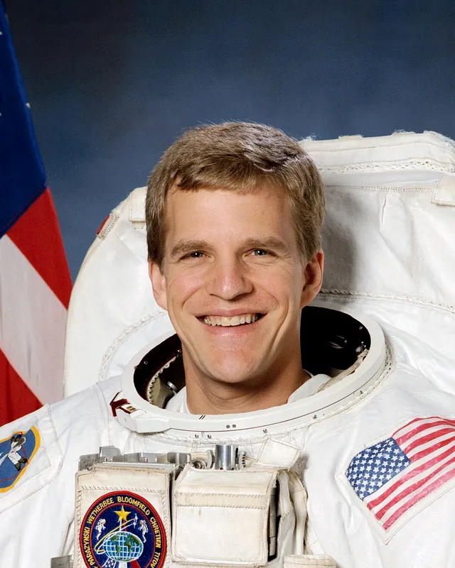 Portrait of Scott Parazynski in a NASA spacesuit